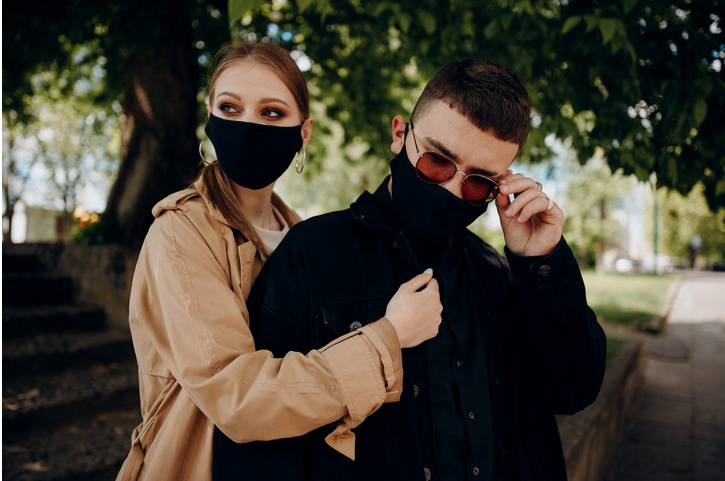 a couple wearing masks